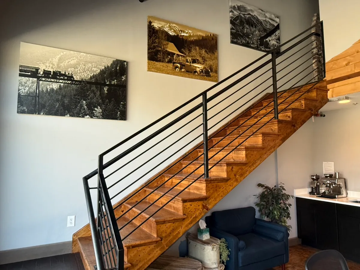 Staircase to the upstairs meeting loft at EchoTrail Coworking